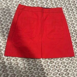 Gently worn womens lined skirt by LOFT size 8. tomato red/ orange